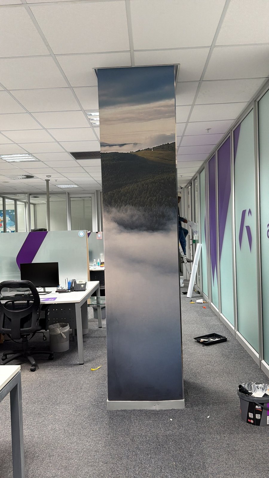 Installer wrapping an architectural column